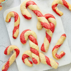 Candy Cane Cookies, festive Christmas baked cookies, holiday peppermint treats, red and white striped cookies, seasonal baking dessert.
