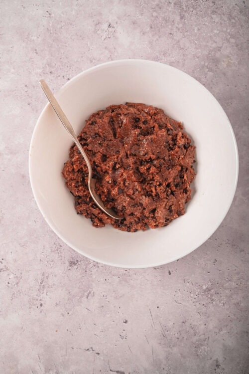 Rich chocolate cookie dough ready for baking, perfect for homemade cookies.