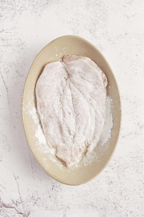 Baked Bree, homemade bread dough, flour-dusted dough for baking bread, fresh bread preparation, artisanal bread making.