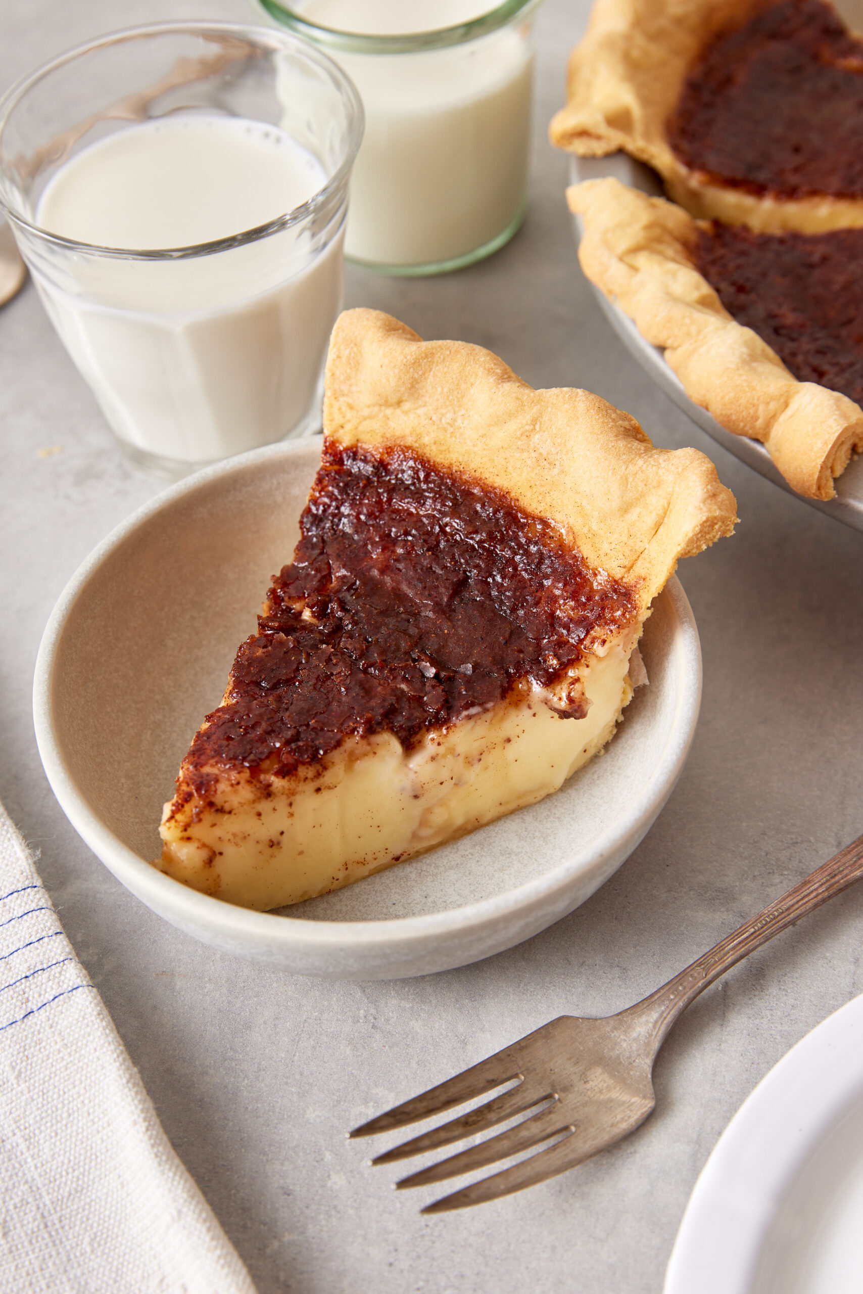 Sugar Cream Pie slice on a plate shot from diagonal
